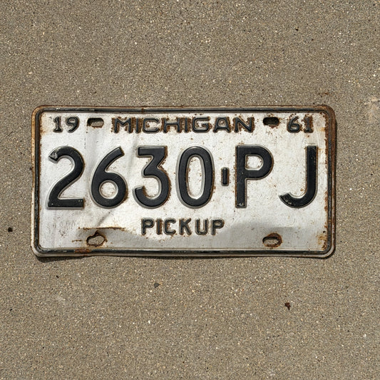 Photo of a 1961 Michigan Truck License Plate Auto Tag Garage Decor Vintage Pickup 2630 PJ with original patina