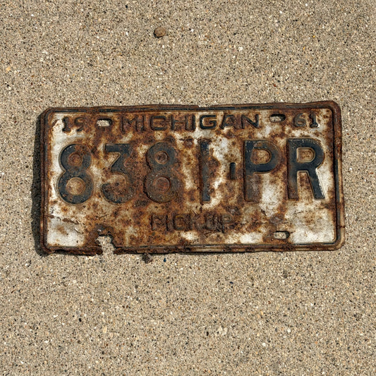 Photo of a 1961 Michigan Truck License Plate Auto Tag Garage Decor Vintage Pickup 8381 PR with original patina