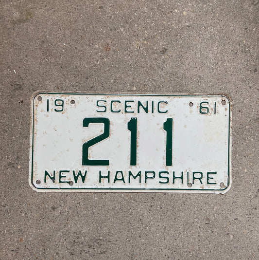 Photo of a 1961 New Hampshire License Plate Auto Tag Garage Decor Vintage Low Number Three Digit 211 with original patina