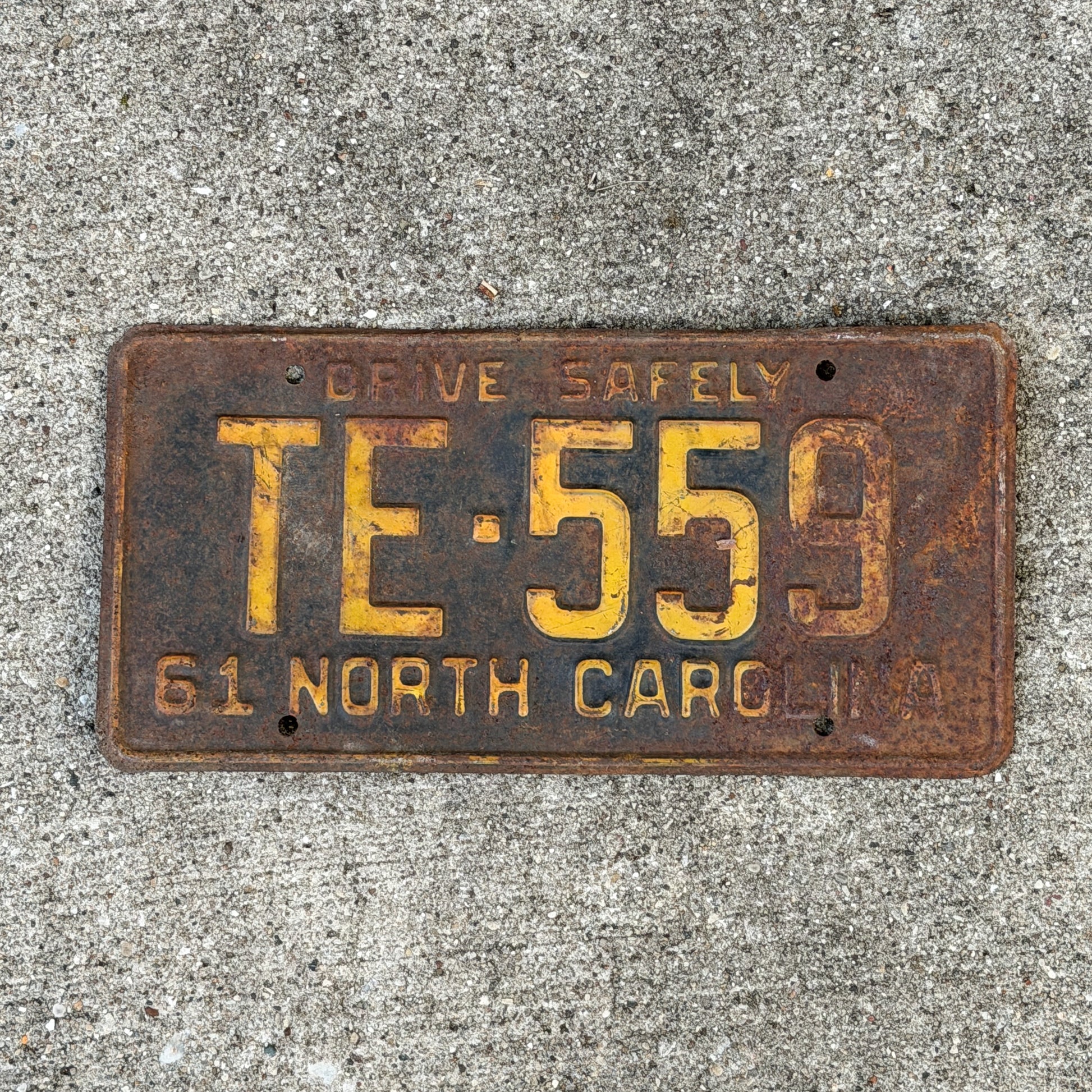 Photo of a 1961 North Carolina License Plate Auto Tag Garage Decor Vintage TE 559 with original patina