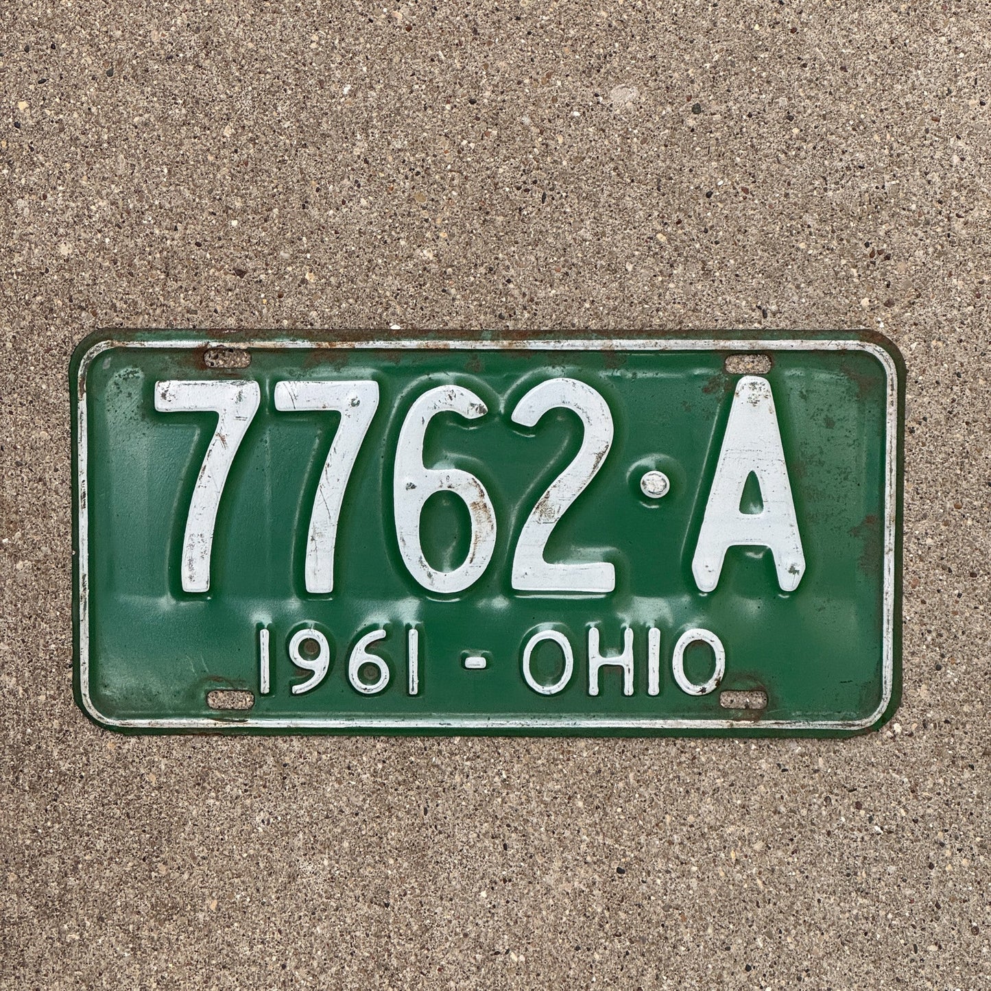 Photo of a 1961 Ohio License Plate Auto Tag Garage Decor Vintage 7762 A with original patina
