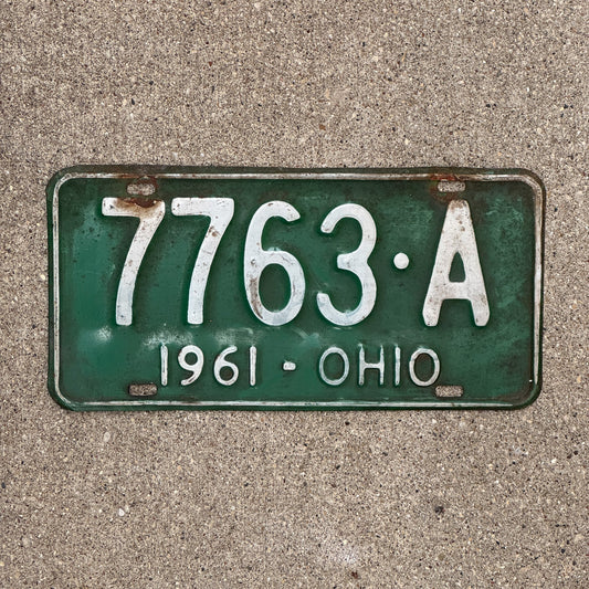 Photo of a 1961 Ohio License Plate Auto Tag Garage Decor Vintage 7763 A with original patina
