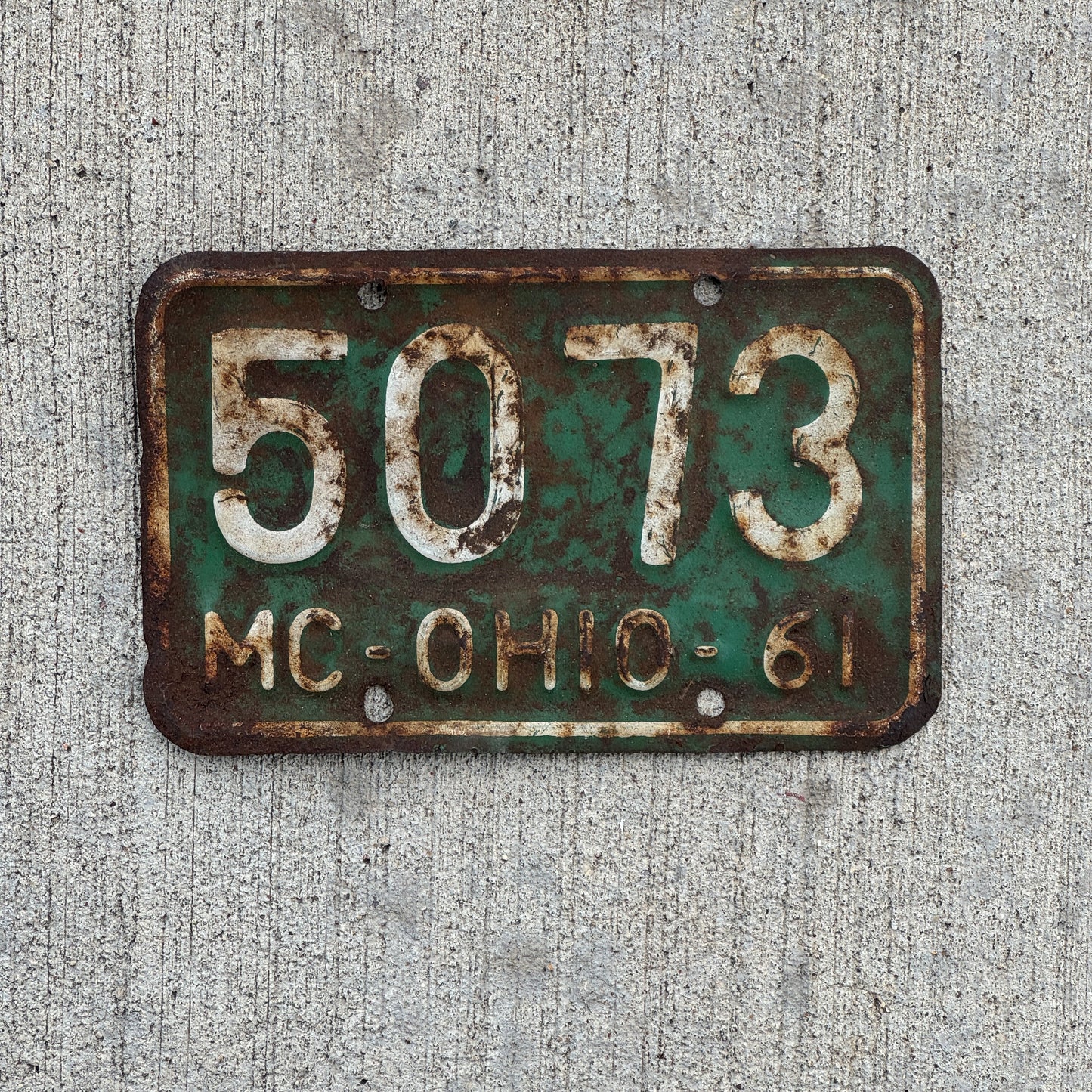 Photo of a 1961 Ohio Motorcycle License Plate Auto Tag Garage Decor Vintage 5073 with original patina