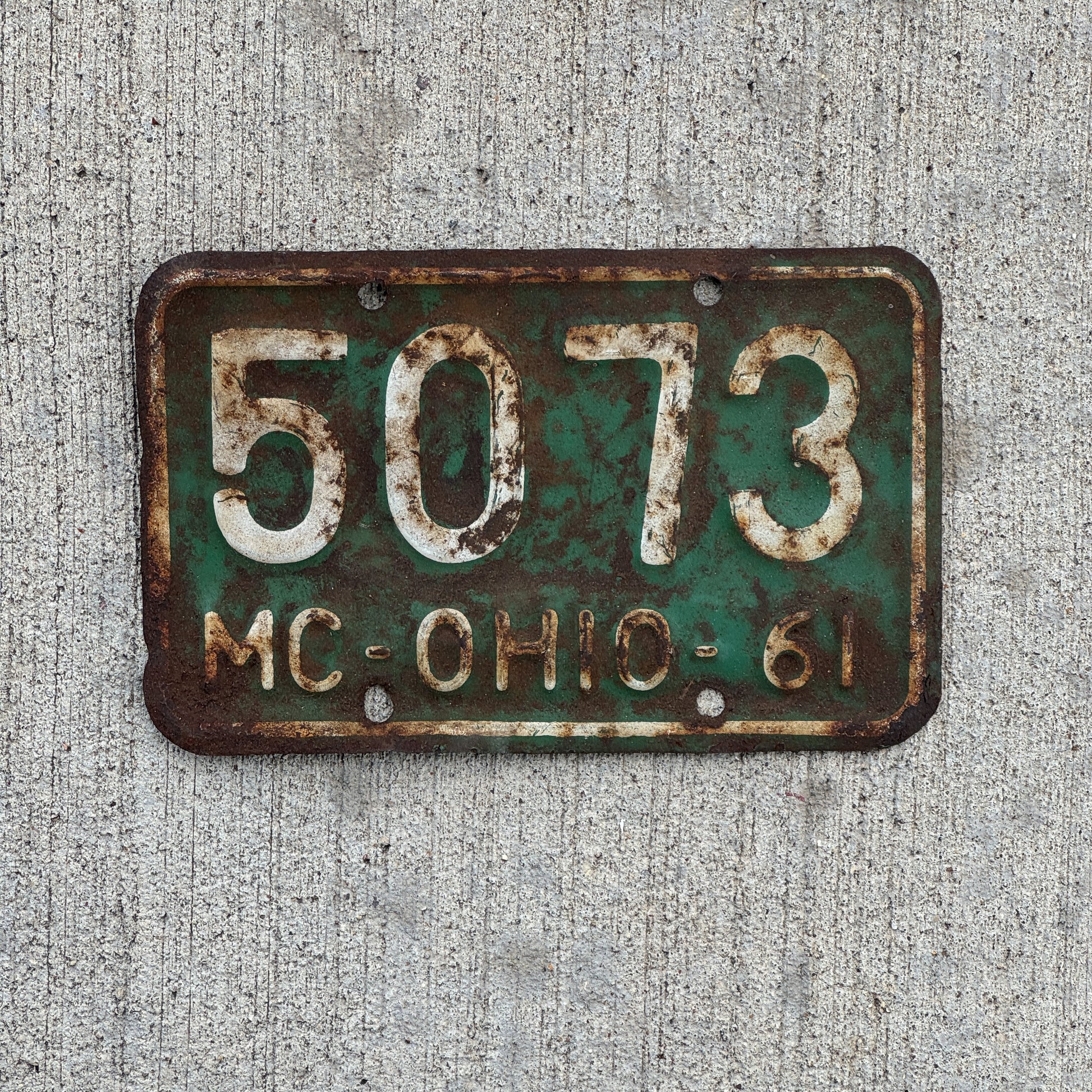 Photo of a 1961 Ohio Motorcycle License Plate Auto Tag Garage Decor Vintage 5073 with original patina