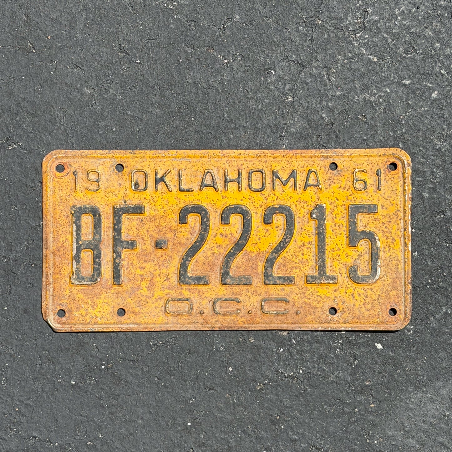 Photo of a 1961 Oklahoma Corporation Commission License Plate Auto Tag Garage Decor Vintage Repeat Repeating BF 22215 with original patina