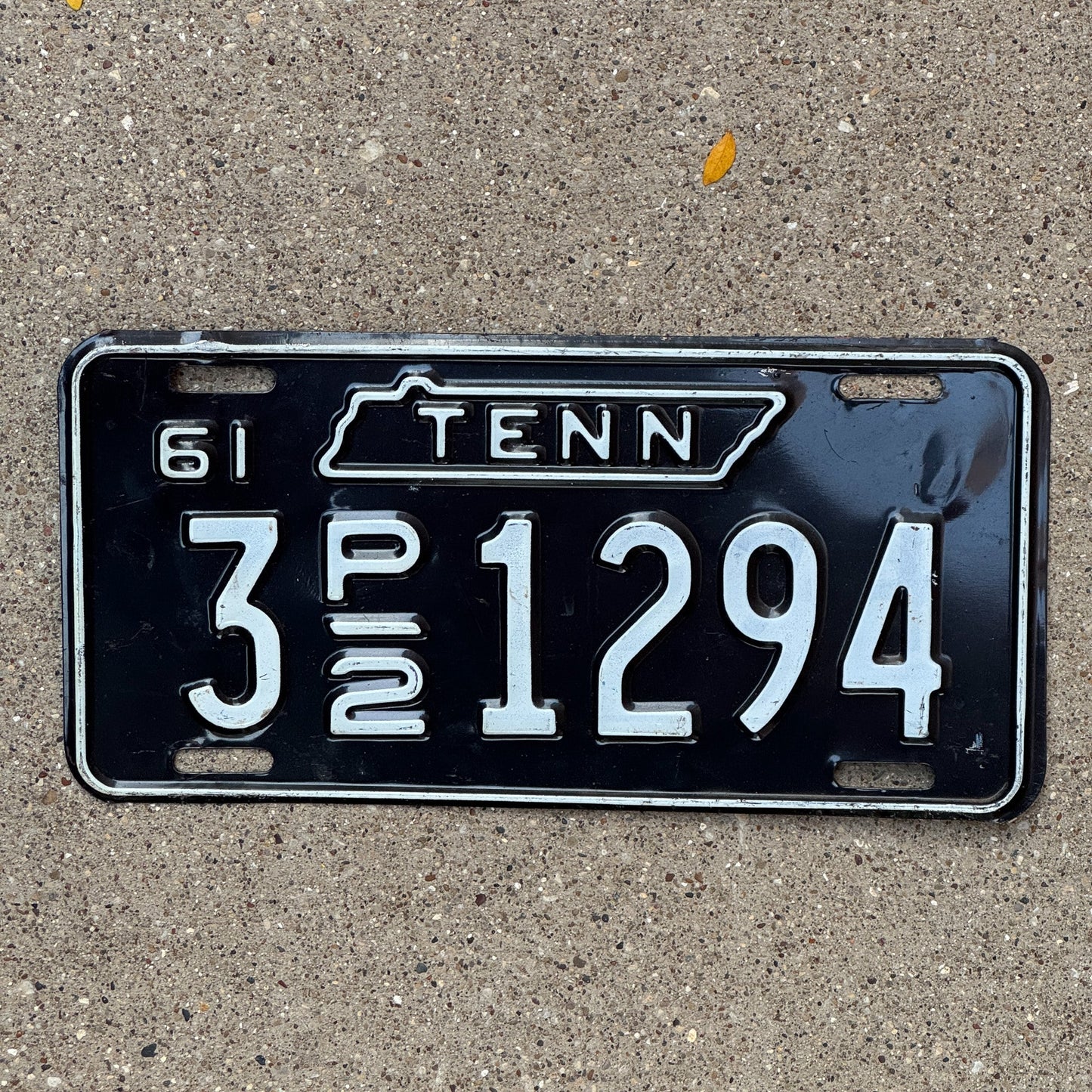 Photo of a 1961 Tennessee Truck License Plate Auto Tag Garage Decor Vintage 3 P2 1294