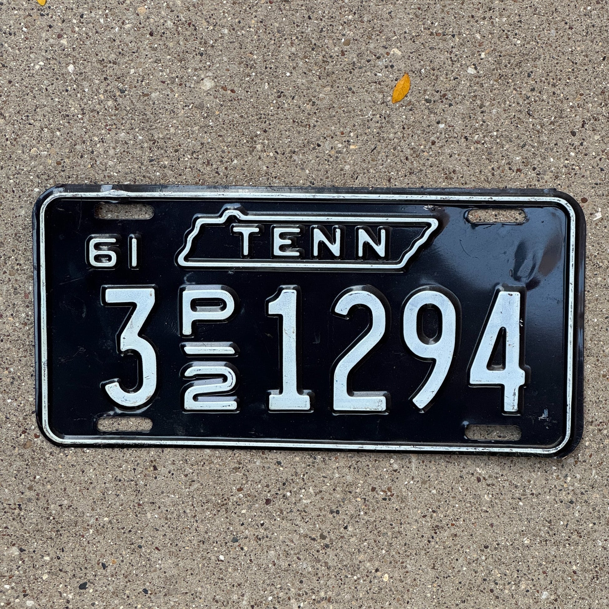 Photo of a 1961 Tennessee Truck License Plate Auto Tag Garage Decor Vintage 3 P2 1294