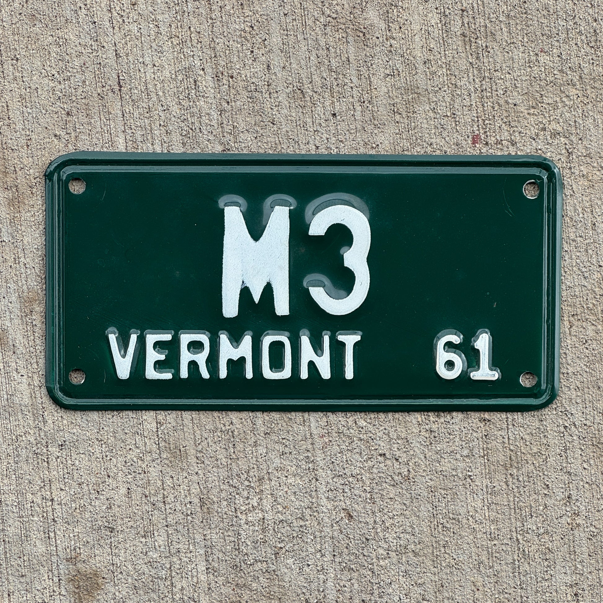 Photo of a 1961 Vermont Motorcycle License Plate Auto Tag 1 Vintage Garage Low Number Single Digit M 3 with original patina