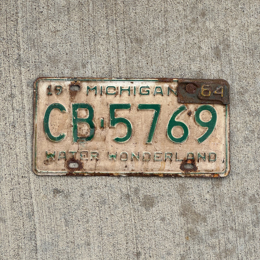 Photo of a 1962 1964 Michigan License Plate Auto Tag Garage Decor Vintage CB 5769 with original patina