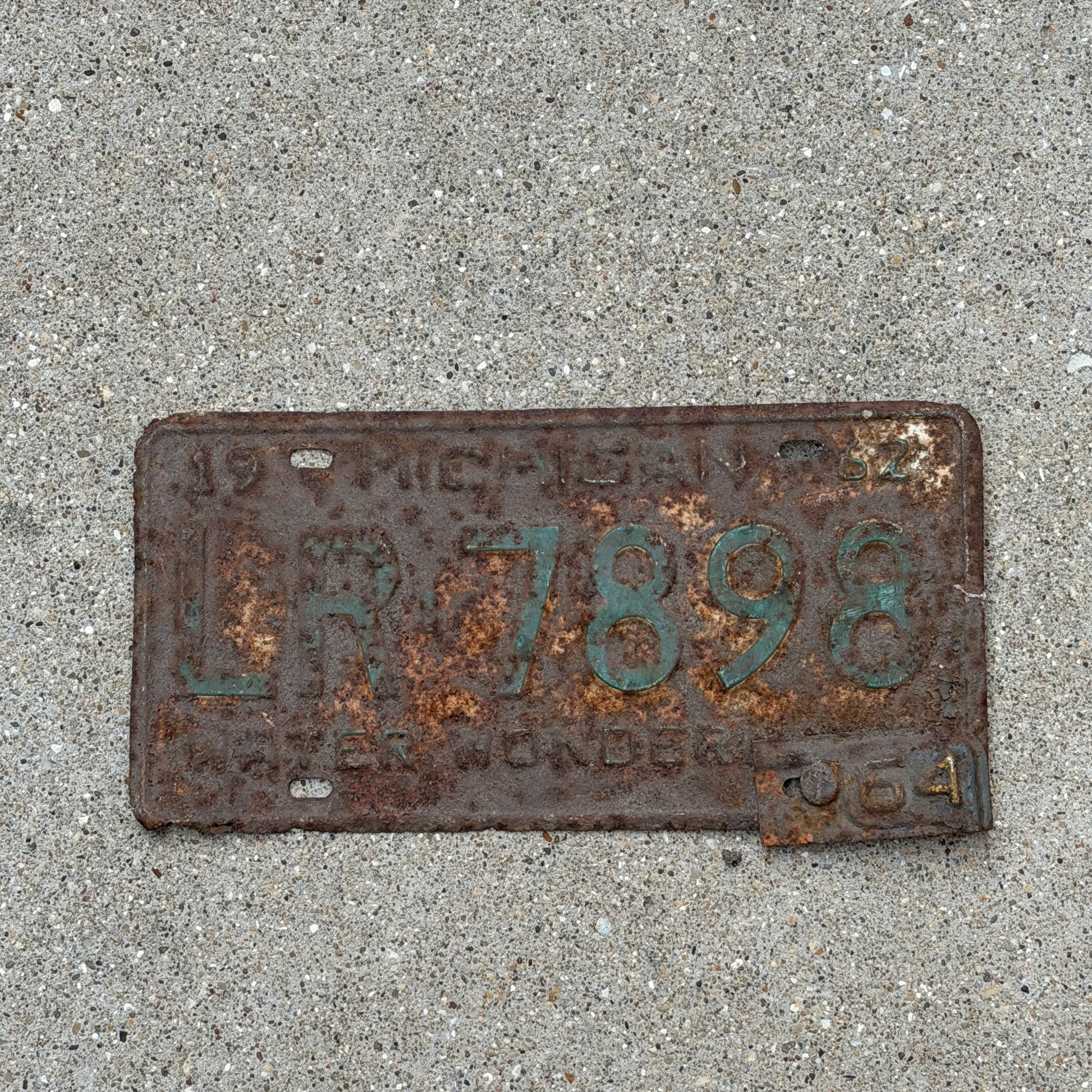 Photo of a 1962 1964 Michigan License Plate Auto Tag Garage Decor Vintage LR 7898 with original patina