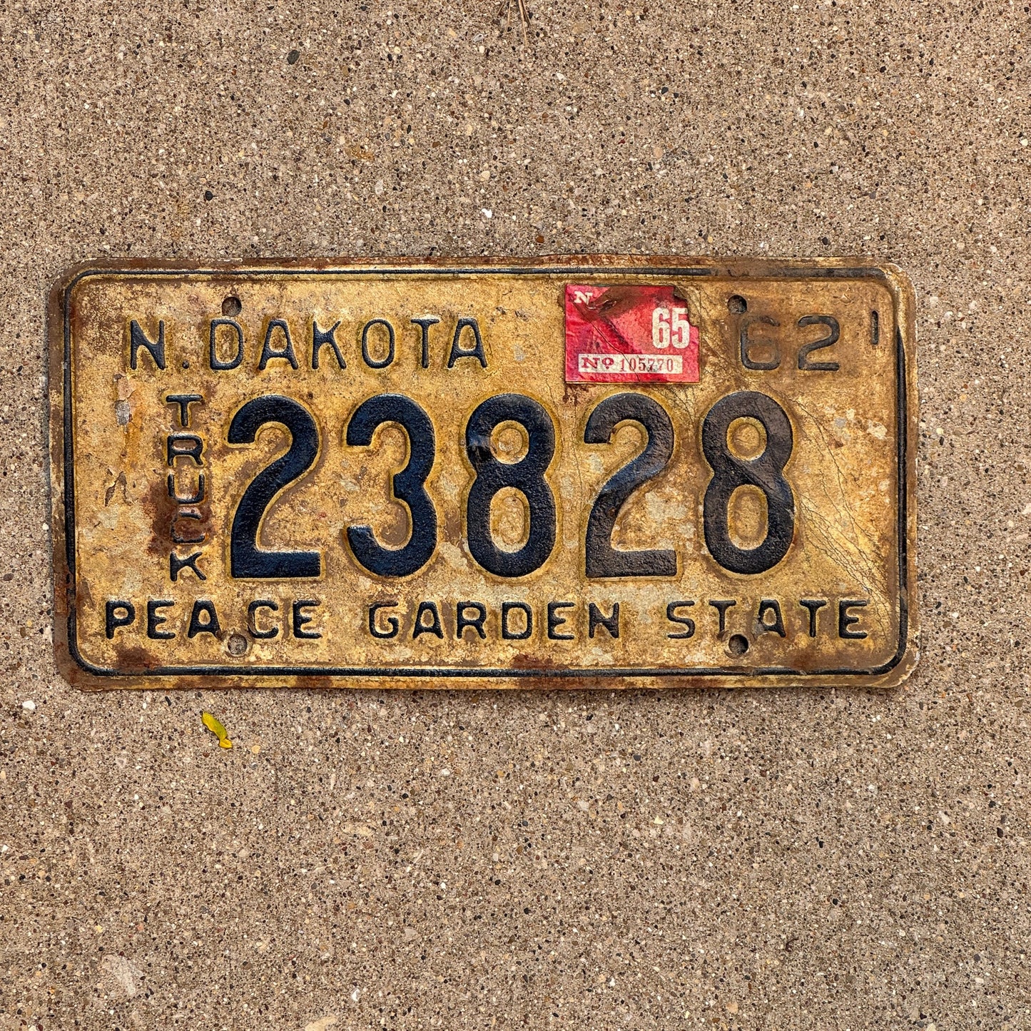 Photo of a 1962 1965 North Dakota Truck License Plate Auto Tag Garage Decor Vintage 23828 with original patina