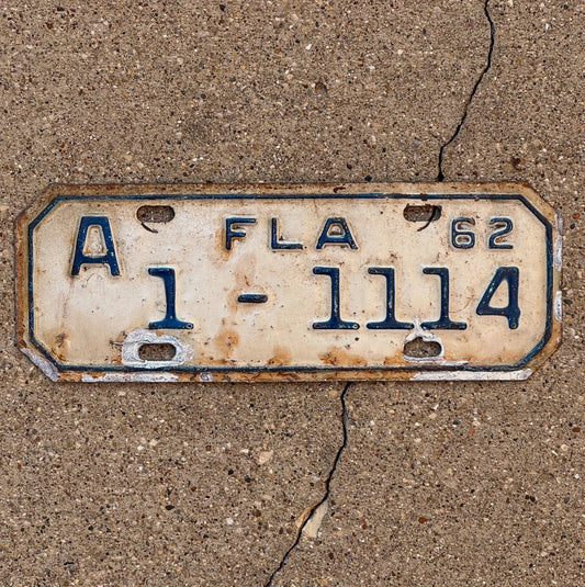 Photo of a 1962 Florida Motorcycle License Plate Auto Tag Garage Decor Vintage Repeat Repeating 1 1114 with original patina