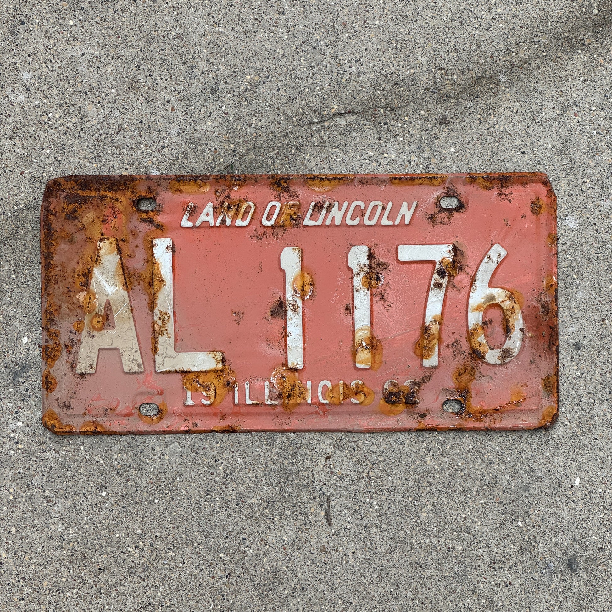 Photo of a 1962 Illinois License Plate Auto Tag 1 Vintage Garage AL 1176 with original patina