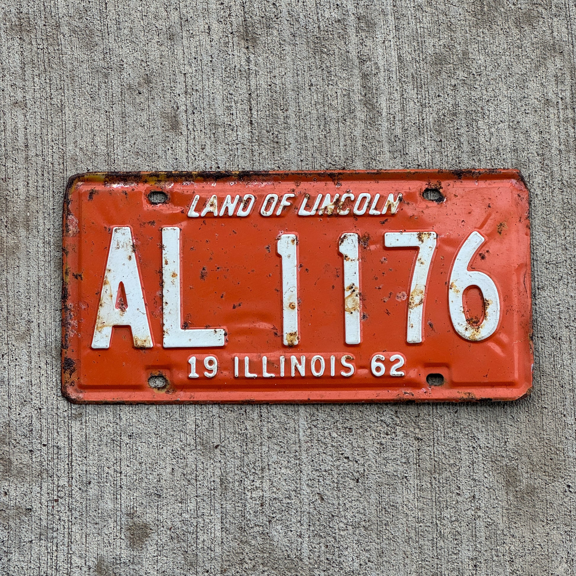 Photo of a 1962 Illinois License Plate Auto Tag 2 Vintage Garage AL 1176 with original patina