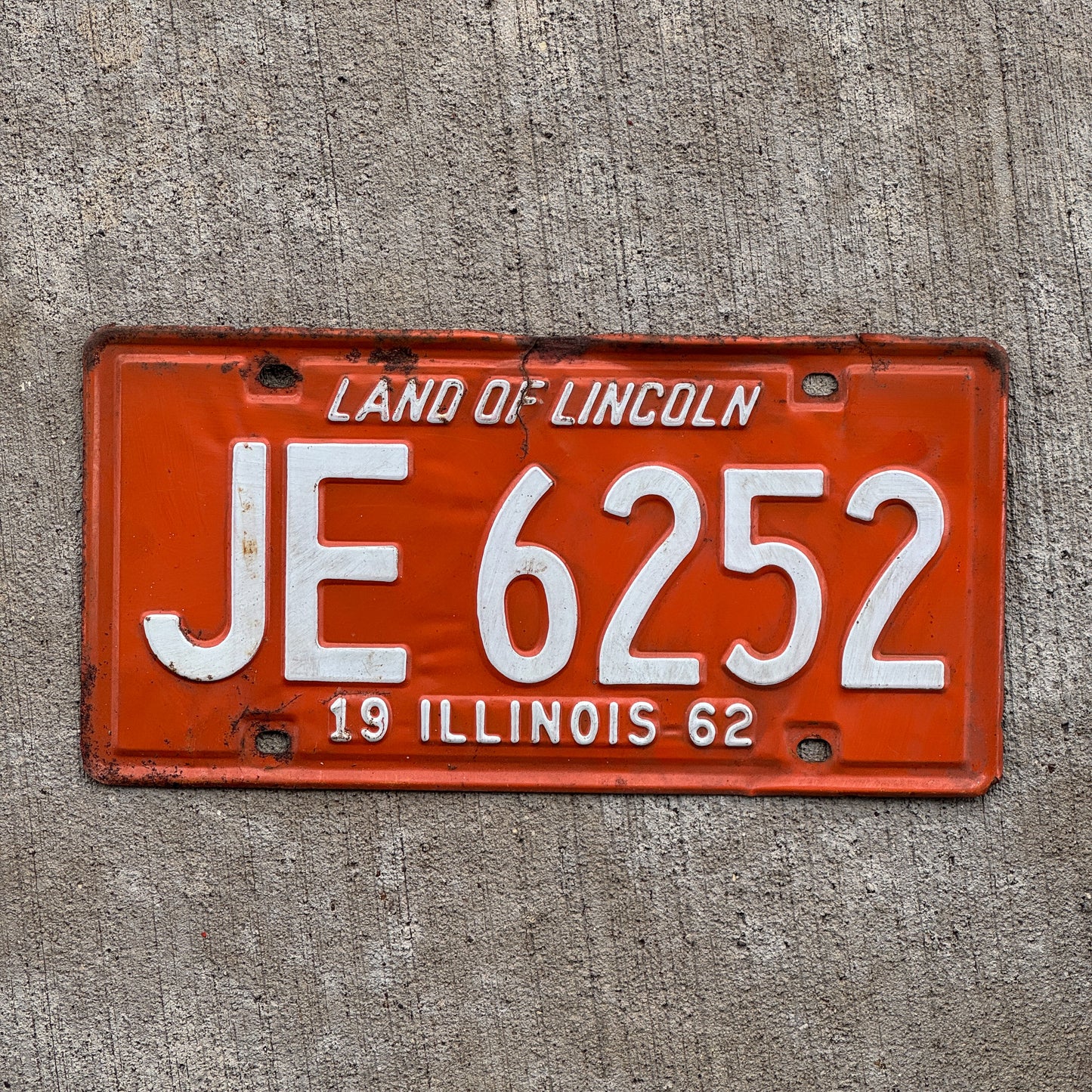 Photo of a 1962 Illinois License Plate Auto Tag 2 Vintage Garage JE 6252 with original patina