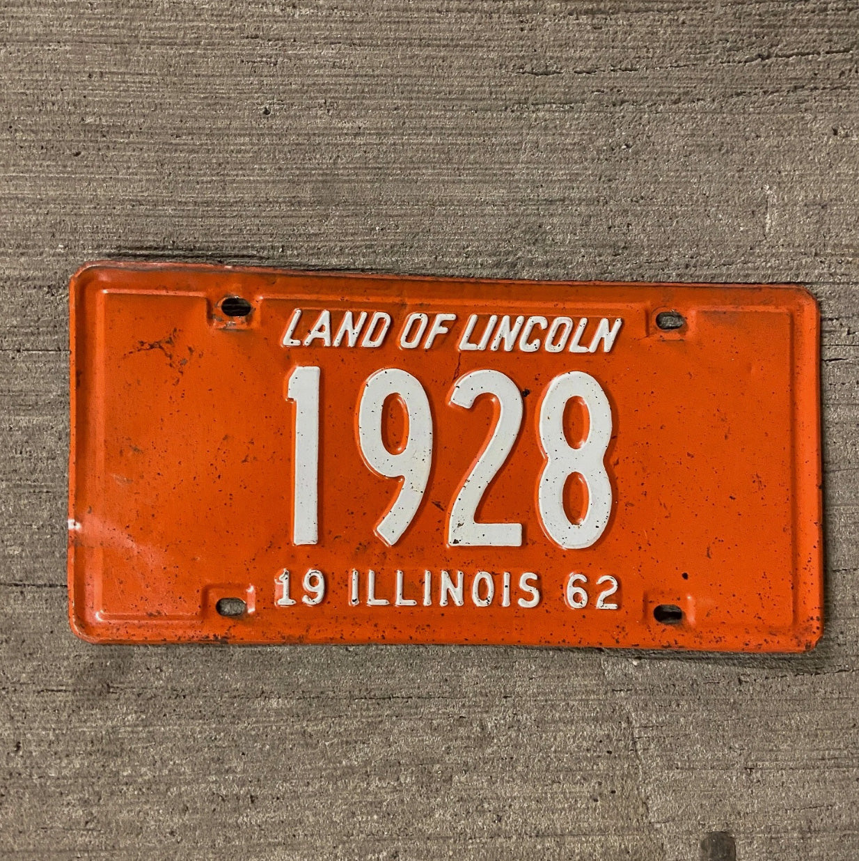 Photo of a 1962 Illinois License Plate Auto Tag Garage Decor Vintage Low Number Four Digit 1928 with original patina