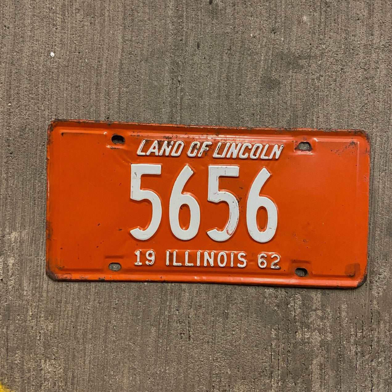 Photo of a 1962 Illinois License Plate Auto Tag Garage Decor Vintage Low Number Four Digit 5656 with original patina