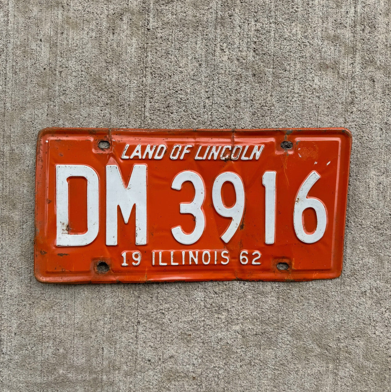 Photo of a 1962 Illinois License Plate Auto Tag Garage Decor Vintage Orange White DM 3916