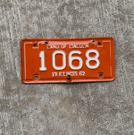 Photo of a 1962 Illinois Motorcycle License Plate Auto Tag Garage Decor Vintage Low Number Four Digit 1068 with original patina