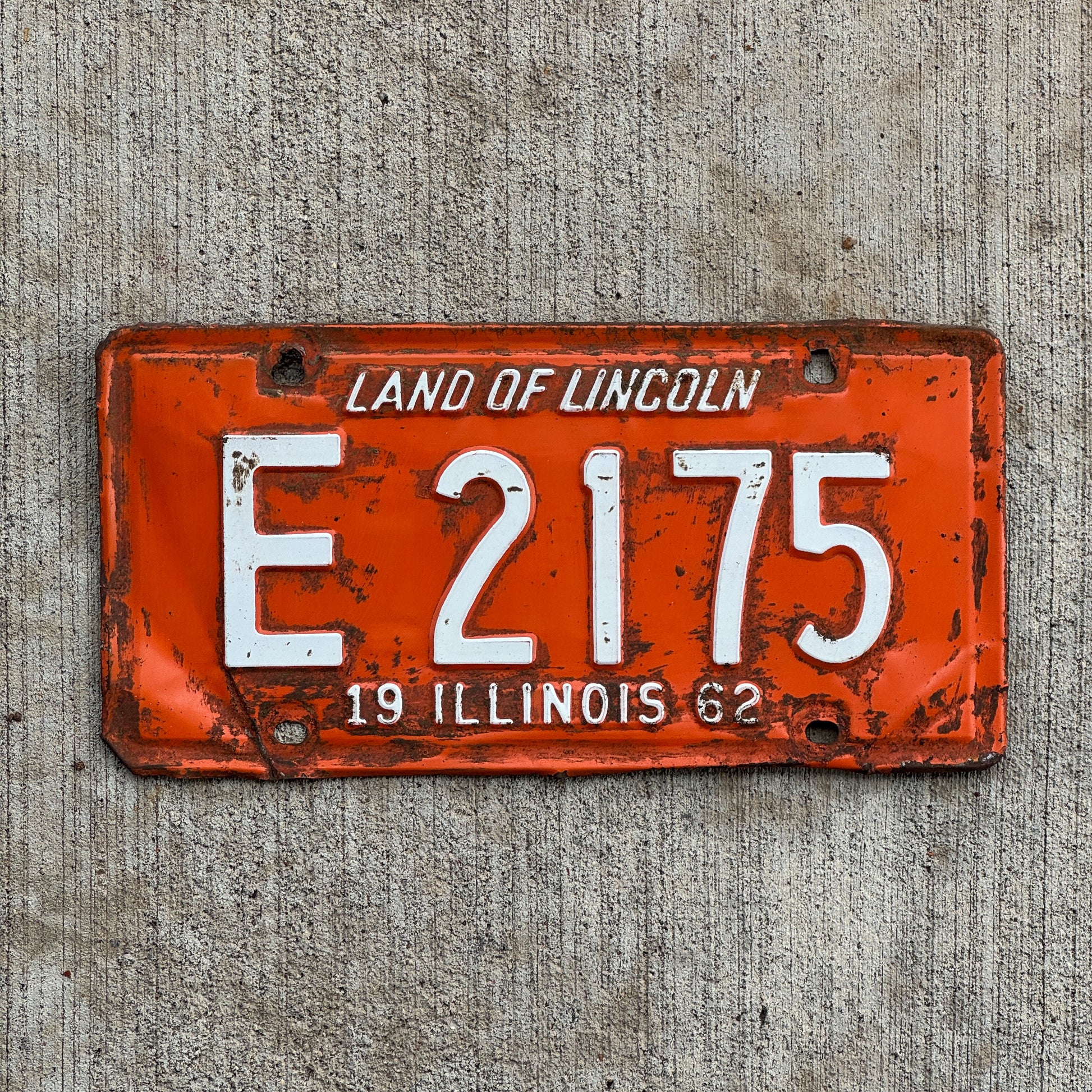 Photo of a 1962 Illinois Truck License Plate Auto Tag Garage Decor Vintage E 2175 with original patina