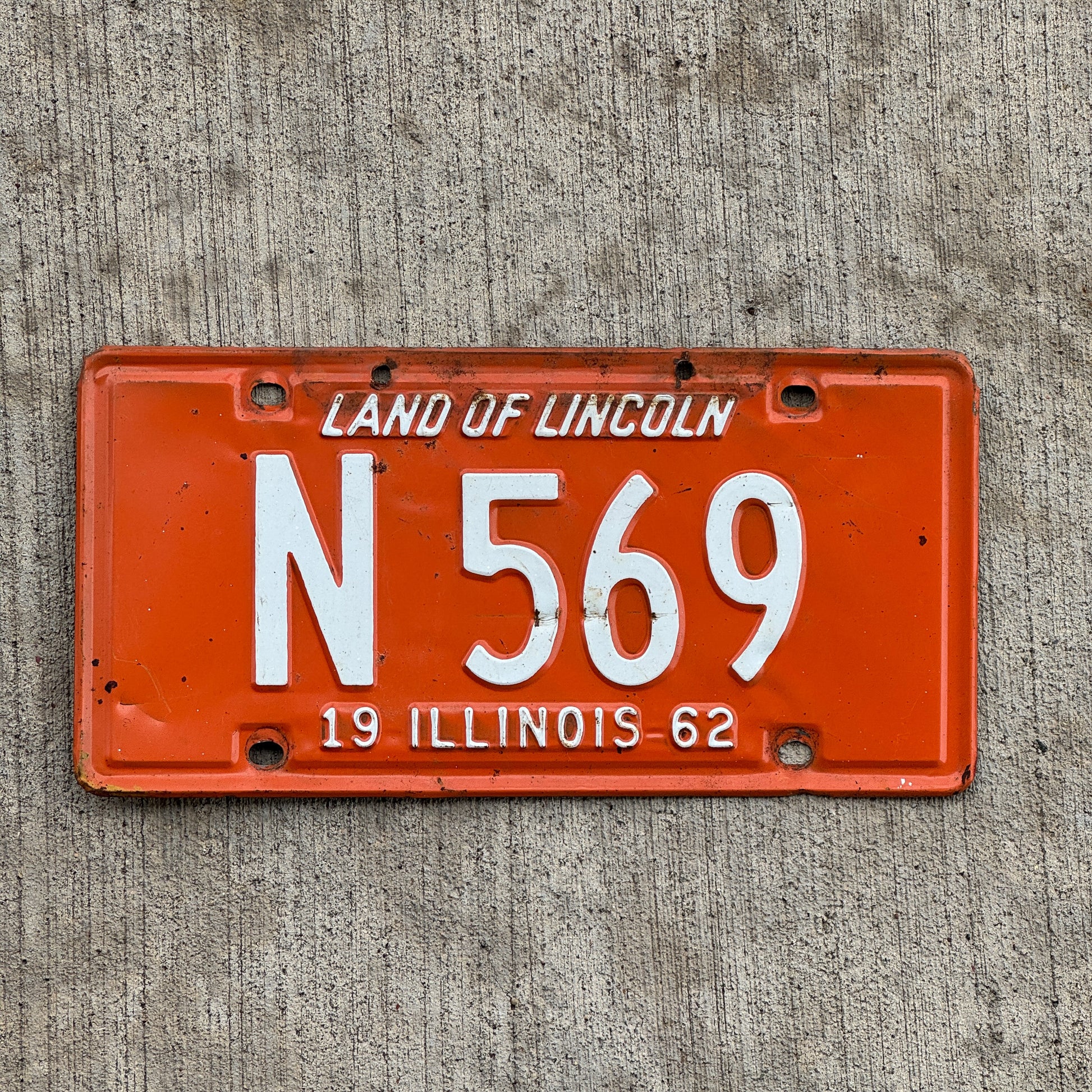 Photo of a 1962 Illinois Truck License Plate Auto Tag Garage Decor Vintage N 569 with original patina