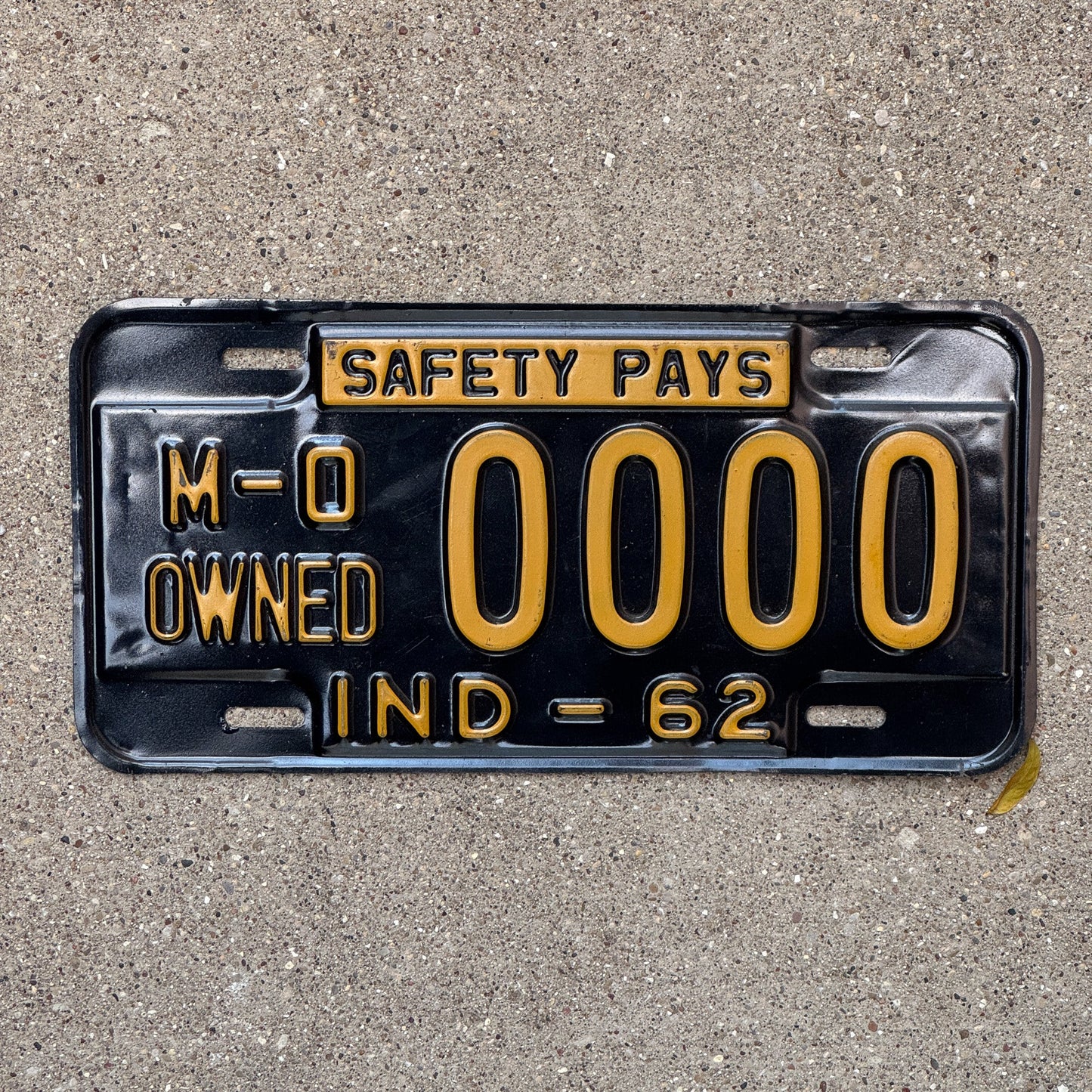 Photo of a 1962 Indiana Municipal Owned License Plate Auto Tag Garage Decor Vintage Sample 0000 with original patina