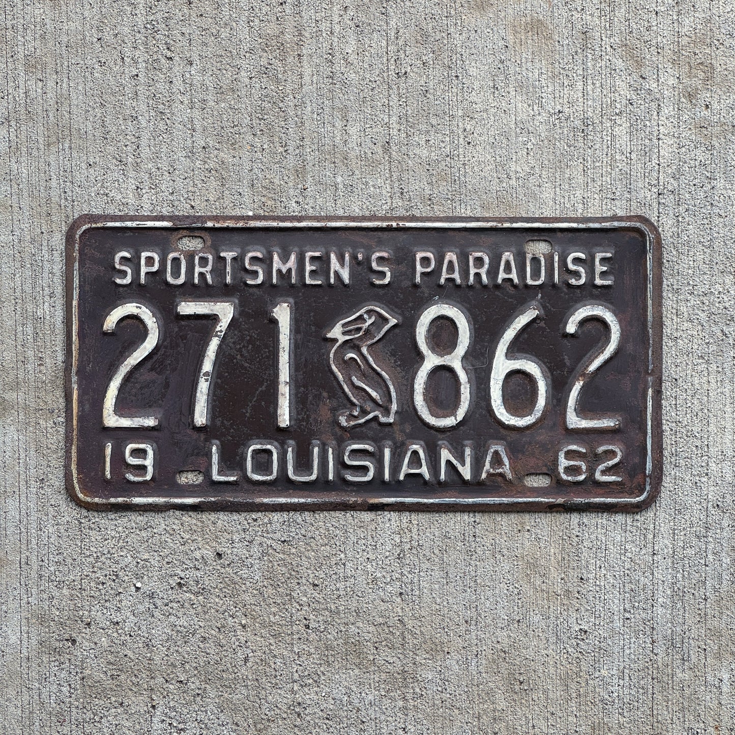 Photo of a 1962 Louisiana License Plate Auto Tag Garage Decor Vintage Iconic Pelican 271 862 with original patina