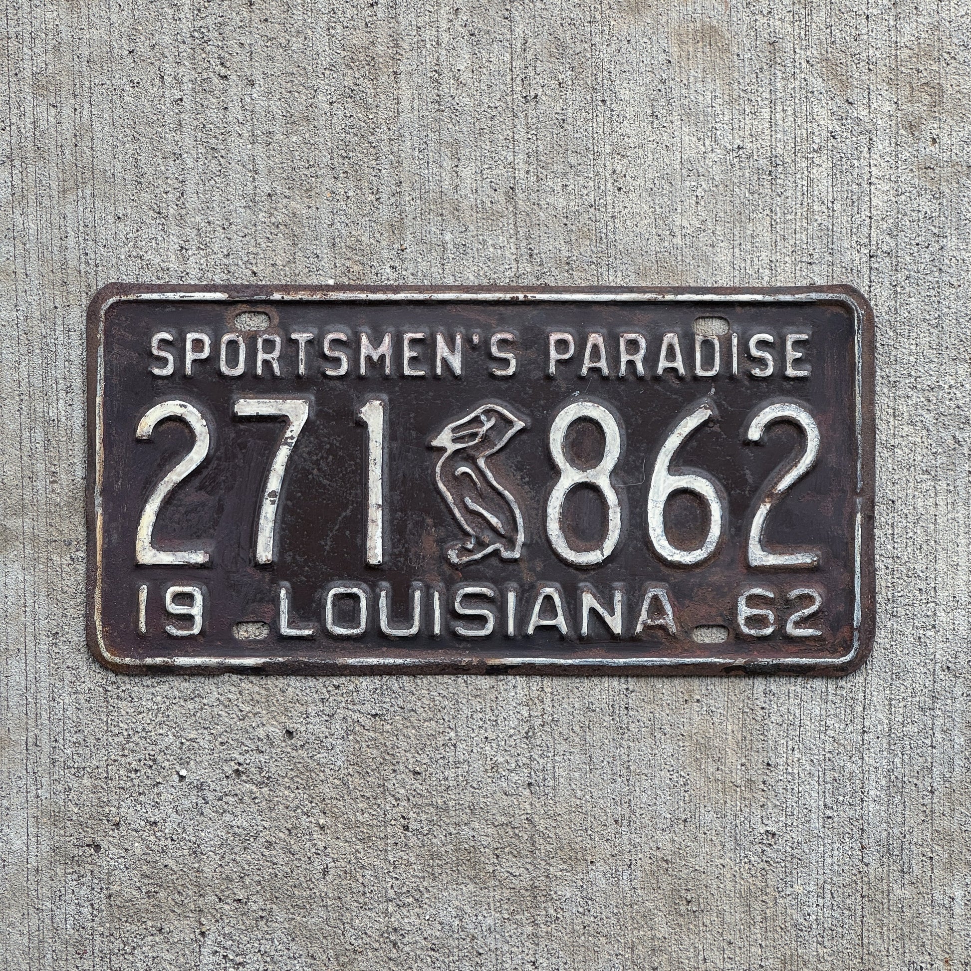 Photo of a 1962 Louisiana License Plate Auto Tag Garage Decor Vintage Iconic Pelican 271 862 with original patina