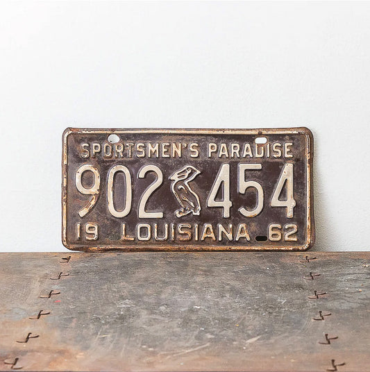 Photo of a 1962 Louisiana License Plate Auto Tag Garage Decor Vintage Iconic Pelican 902 454 with original patina