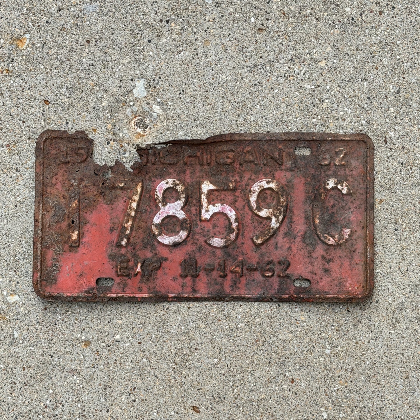 Photo of a 1962 Michigan Commercial License Plate Auto Tag Garage Decor Vintage Half Year 17859 C with original patina
