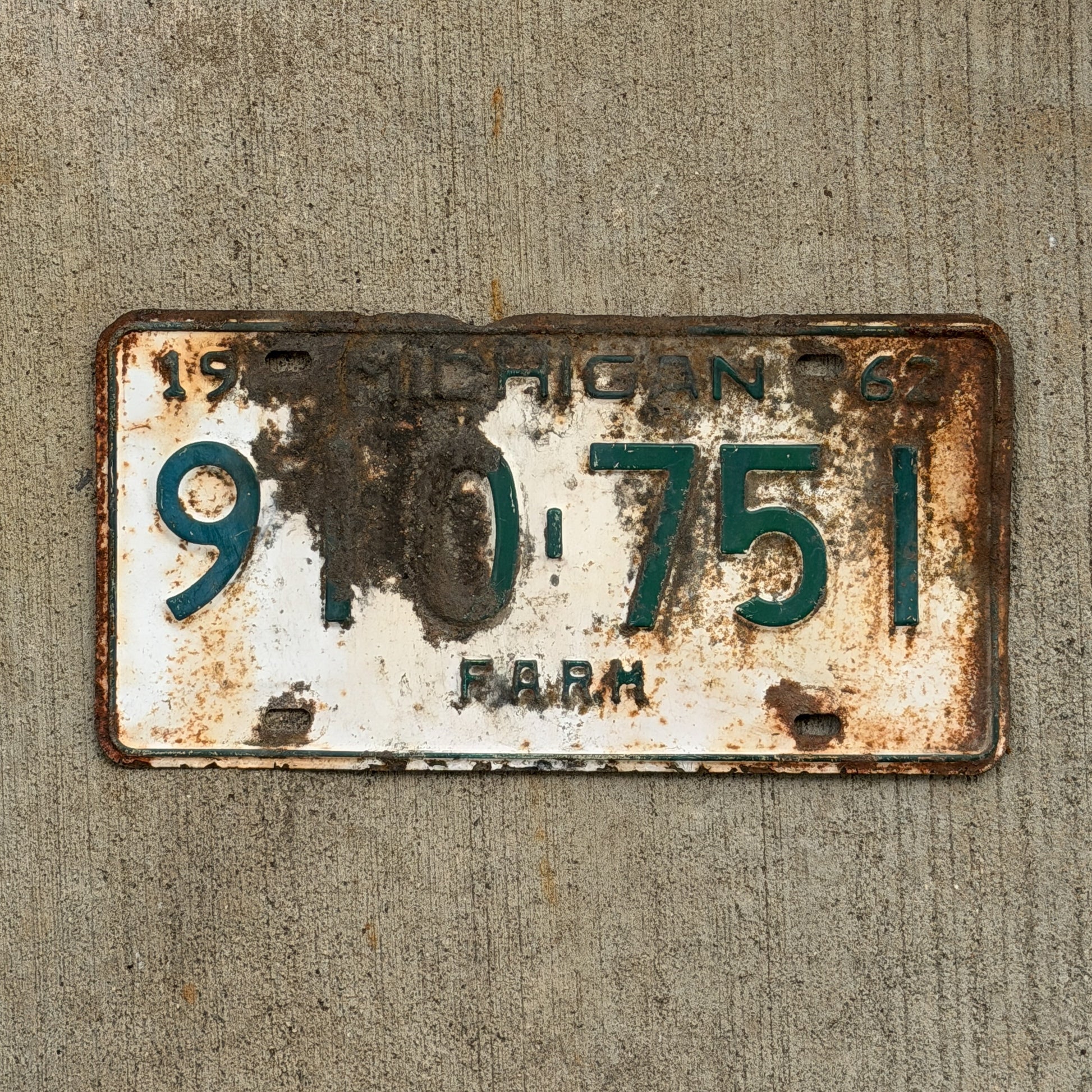 Photo of a 1962 Michigan Farm License Plate Auto Tag Garage Decor Vintage 910 751 with original patina