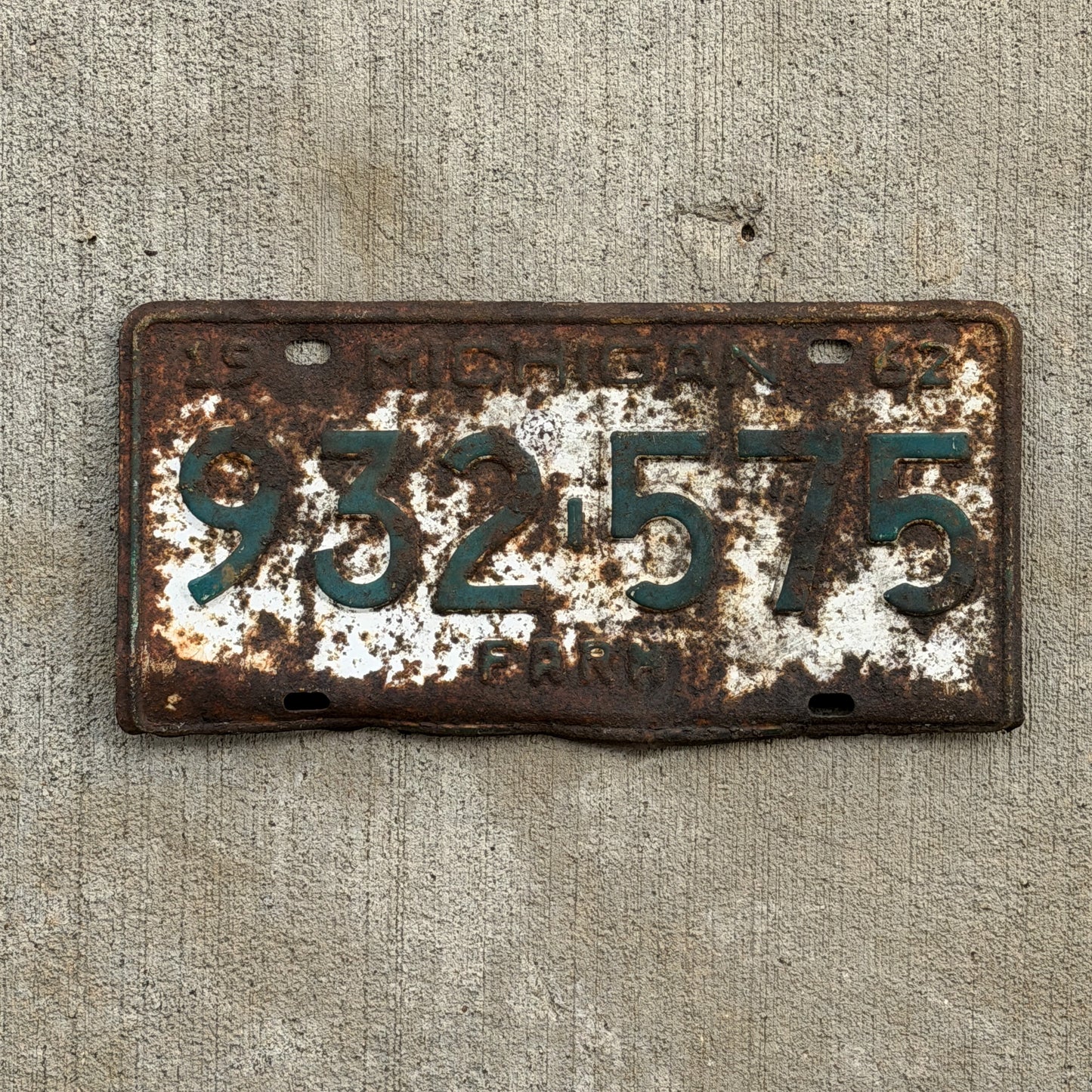 Photo of a 1962 Michigan Farm License Plate Auto Tag Garage Decor Vintage 932 575 with original patina