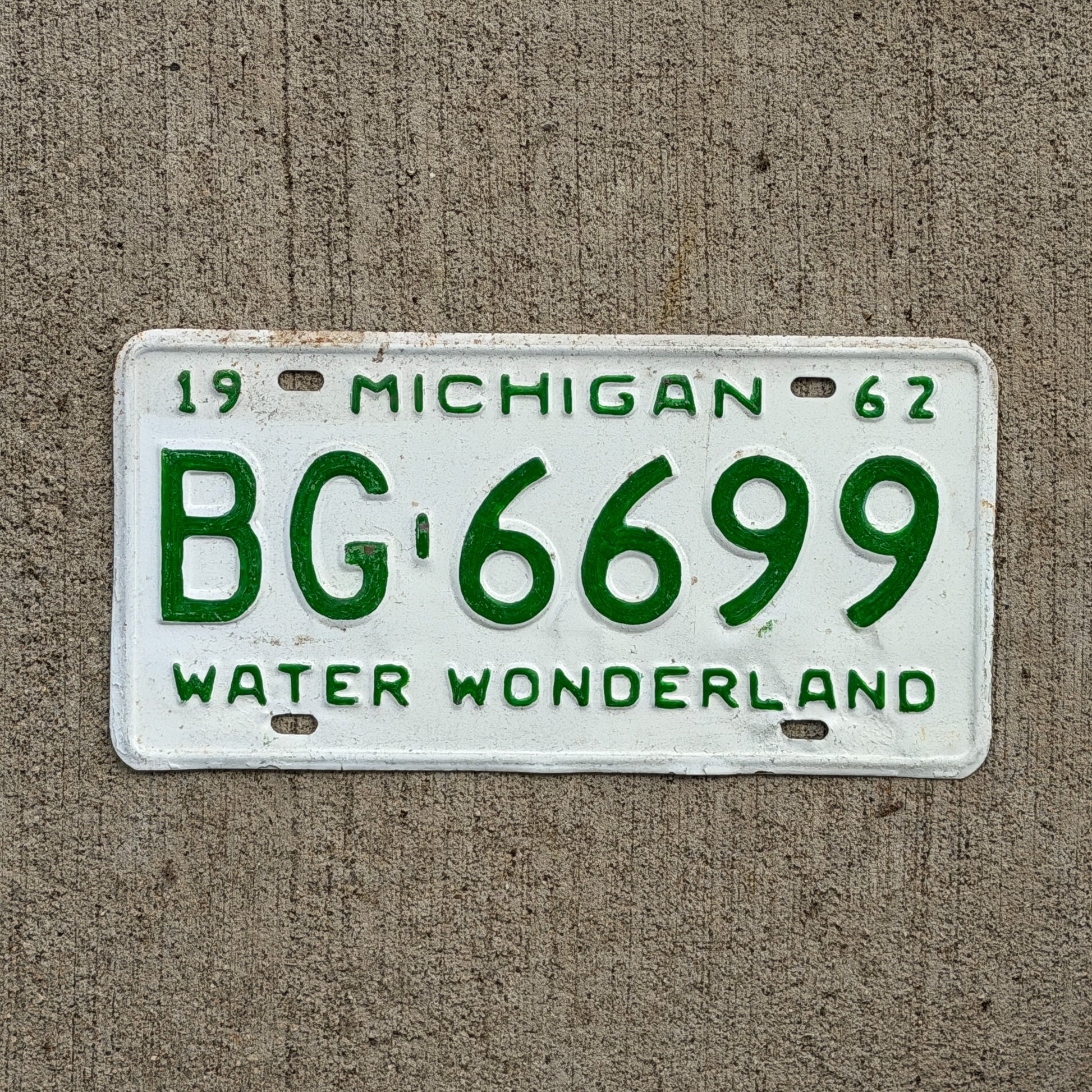 Photo of a 1962 Michigan License Plate Auto Tag Garage Decor Vintage BG 6699 with original patina