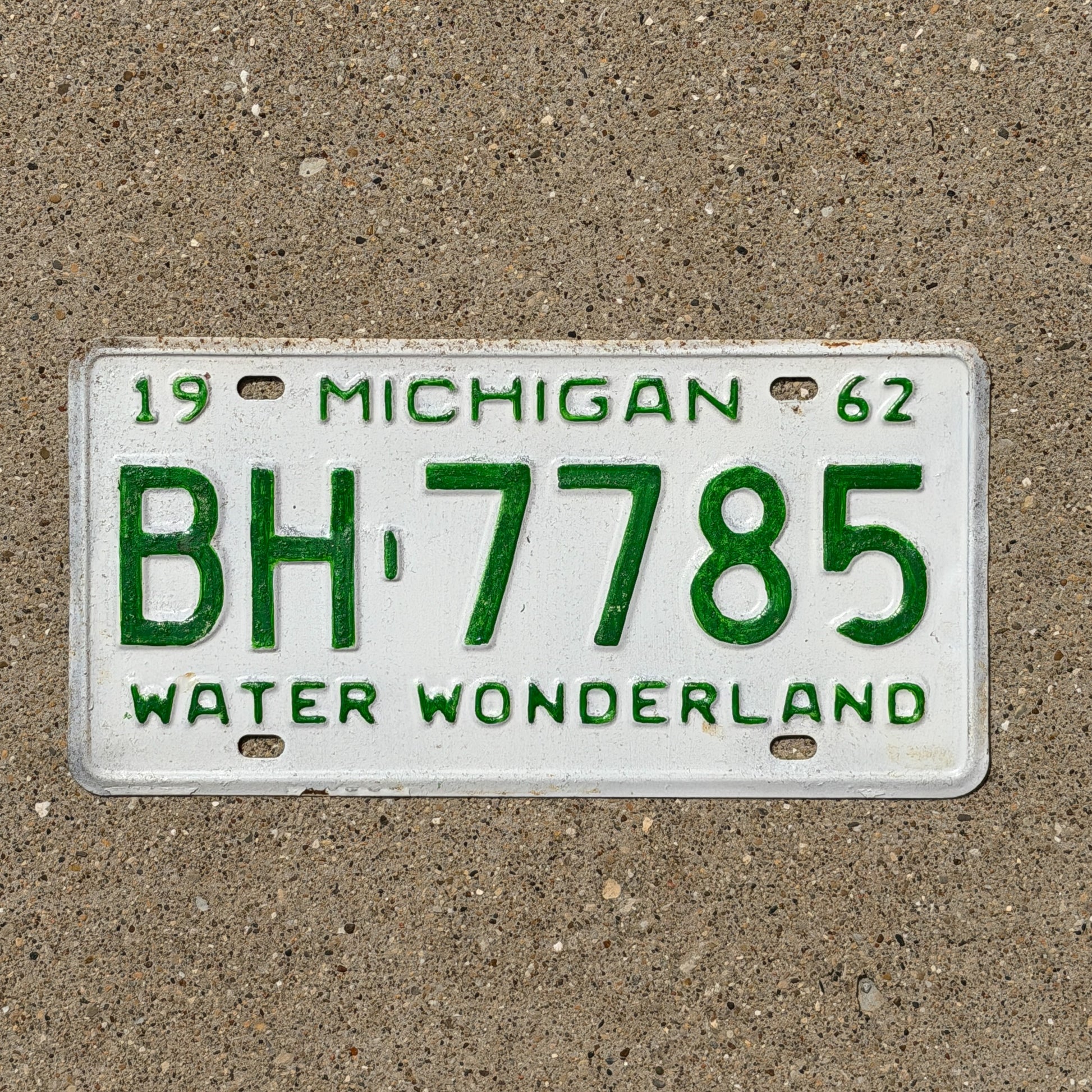 Photo of a 1962 Michigan License Plate Auto Tag Garage Decor Vintage BH 7785 with original patina