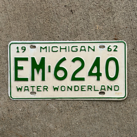 Photo of a 1962 Michigan License Plate Auto Tag Garage Decor Vintage EM 6240 with original patina