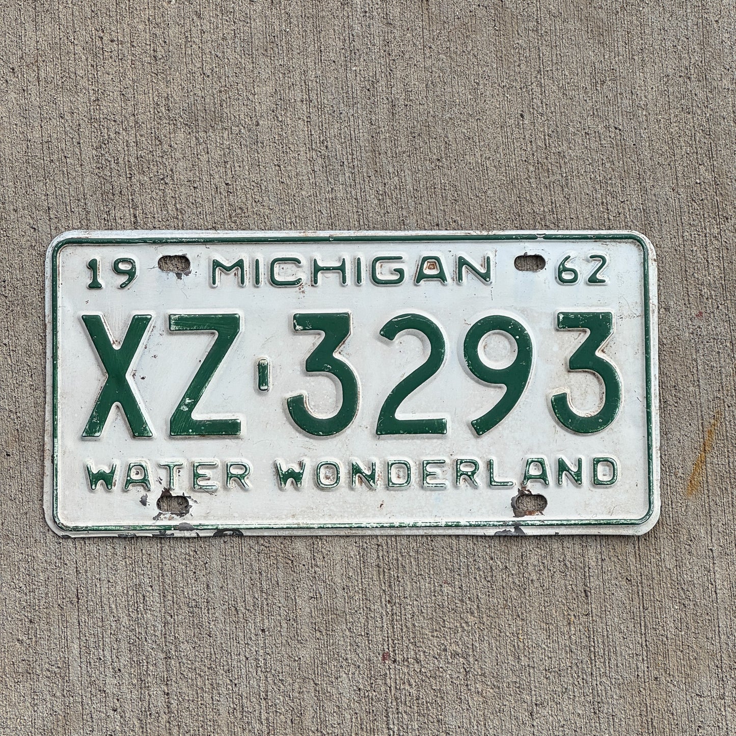 Photo of a 1962 Michigan License Plate Auto Tag Garage Decor Vintage Gogebic County XZ 3293 with original patina