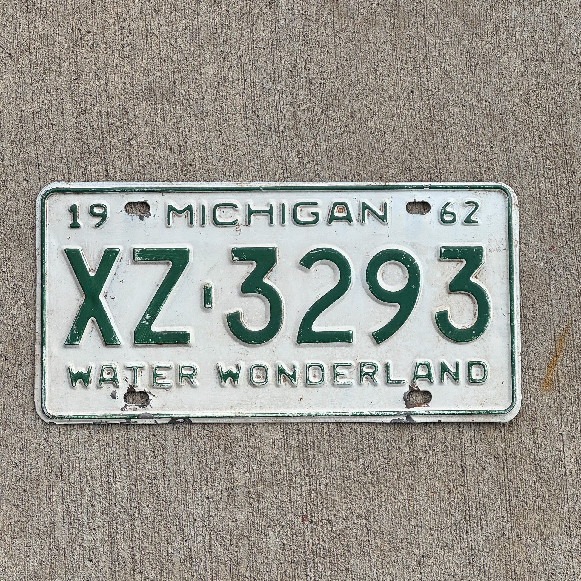 Photo of a 1962 Michigan License Plate Auto Tag Garage Decor Vintage Gogebic County XZ 3293 with original patina