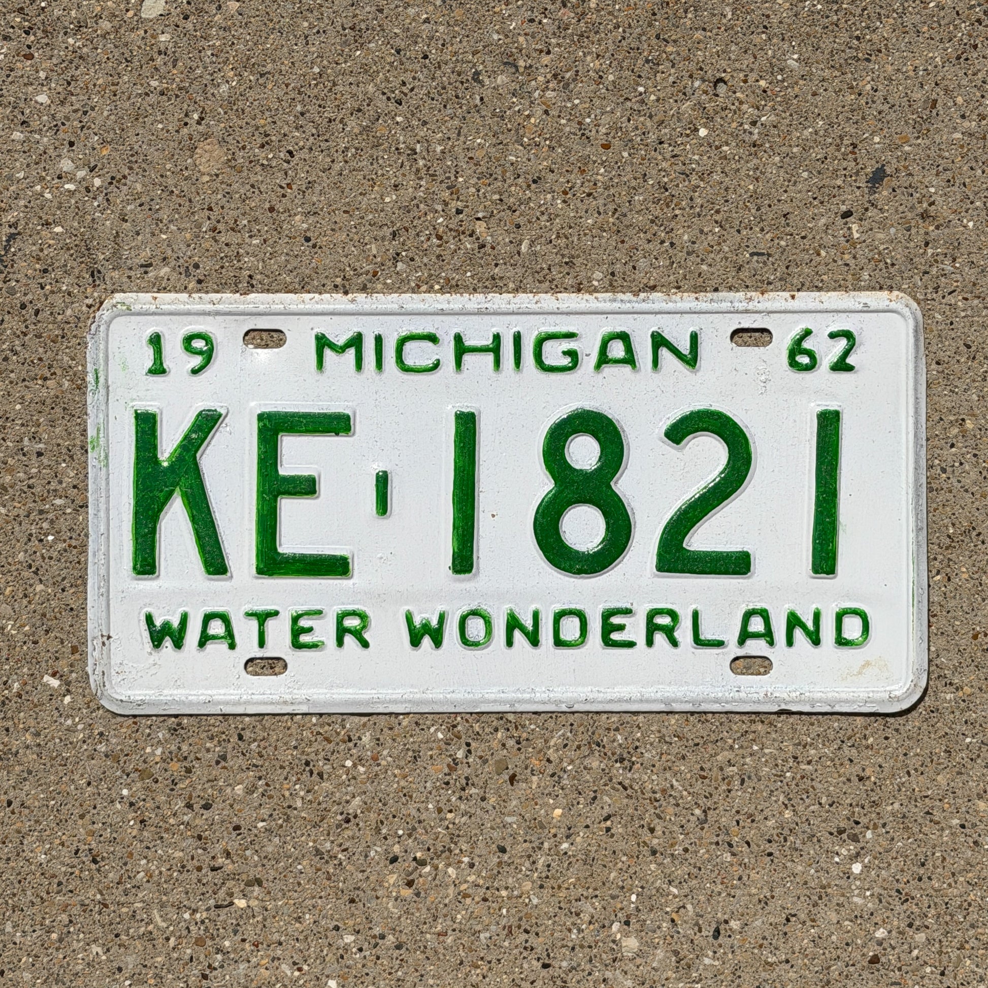 Photo of a 1962 Michigan License Plate Auto Tag Garage Decor Vintage KE 1821 with original patina