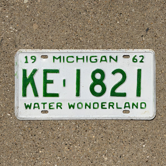 Photo of a 1962 Michigan License Plate Auto Tag Garage Decor Vintage KE 1821 with original patina