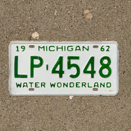 Photo of a 1962 Michigan License Plate Auto Tag Garage Decor Vintage LP 4548 with original patina