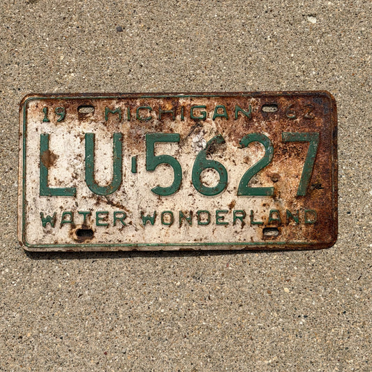 Photo of a 1962 Michigan License Plate Auto Tag Garage Decor Vintage LU 5627 with original patina