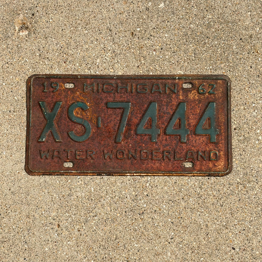Photo of a 1962 Michigan License Plate Auto Tag Garage Decor Vintage Repeat Repeating XS 7444 with original patina