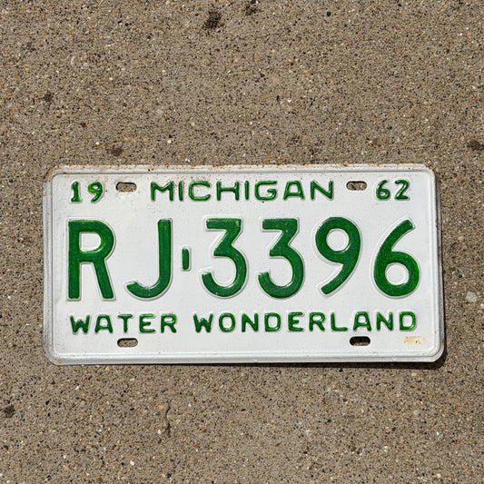 Photo of a 1962 Michigan License Plate Auto Tag Garage Decor Vintage RJ 3396 with original patina
