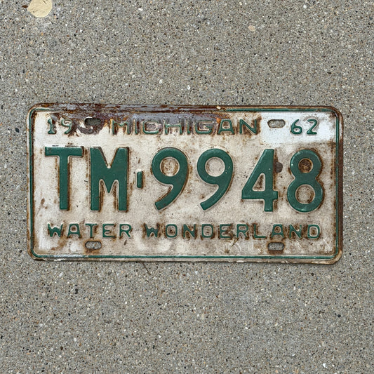 Photo of a 1962 Michigan License Plate Auto Tag Garage Decor Vintage TM 9948 with original patina