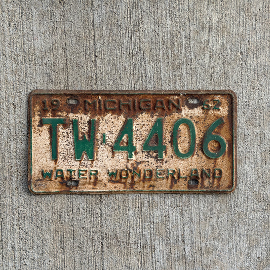 Photo of a 1962 Michigan License Plate Auto Tag Garage Decor Vintage TW 4406 with original patina