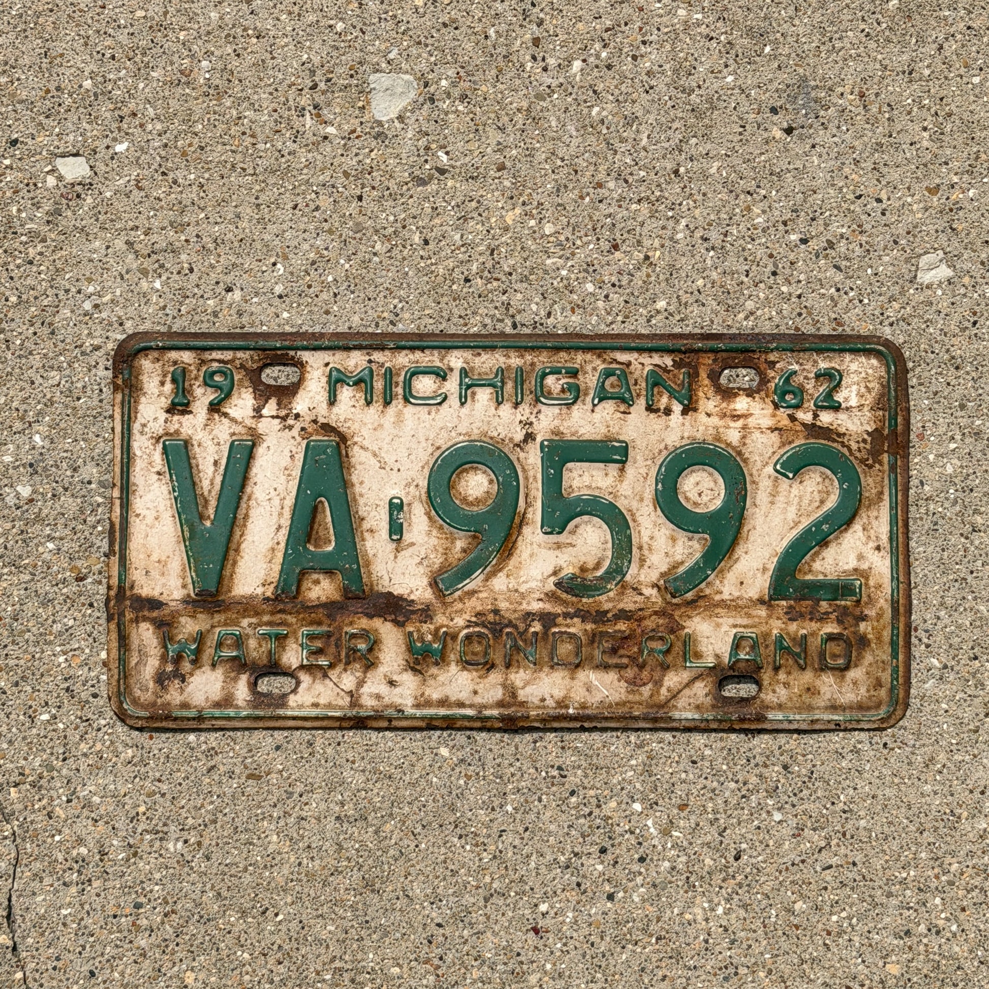 Photo of a 1962 Michigan License Plate Auto Tag Garage Decor Vintage VA 9592 with original patina