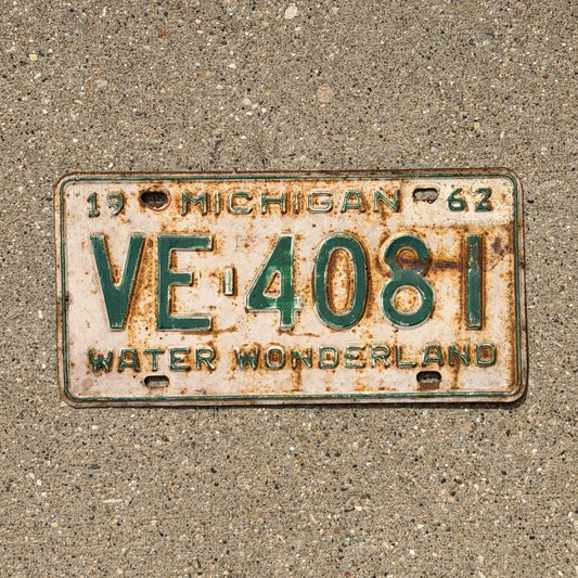 Photo of a 1962 Michigan License Plate Auto Tag Garage Decor Vintage VE 4081 with original patina