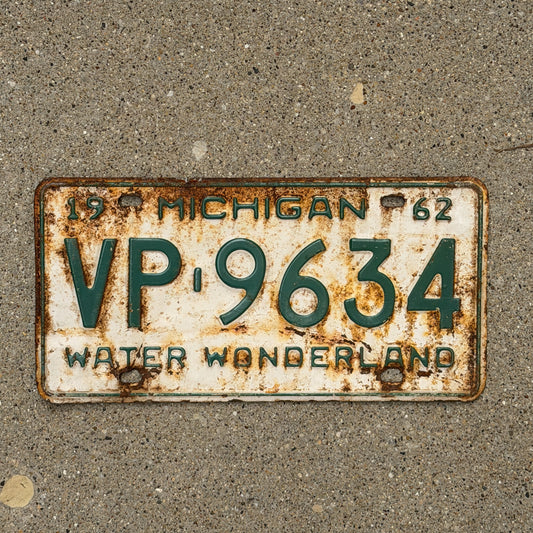 Photo of a 1962 Michigan License Plate Auto Tag Garage Decor Vintage VP 9634 with original patina