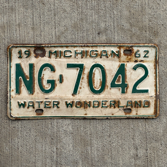 Photo of a 1962 Michigan License Plate Auto Tag Garage Decor Vintage Washtenaw County NG 7042 with original patina