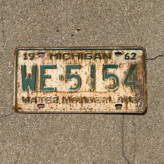 Photo of a 1962 Michigan License Plate Auto Tag Garage Decor Vintage WE 5154 with original patina